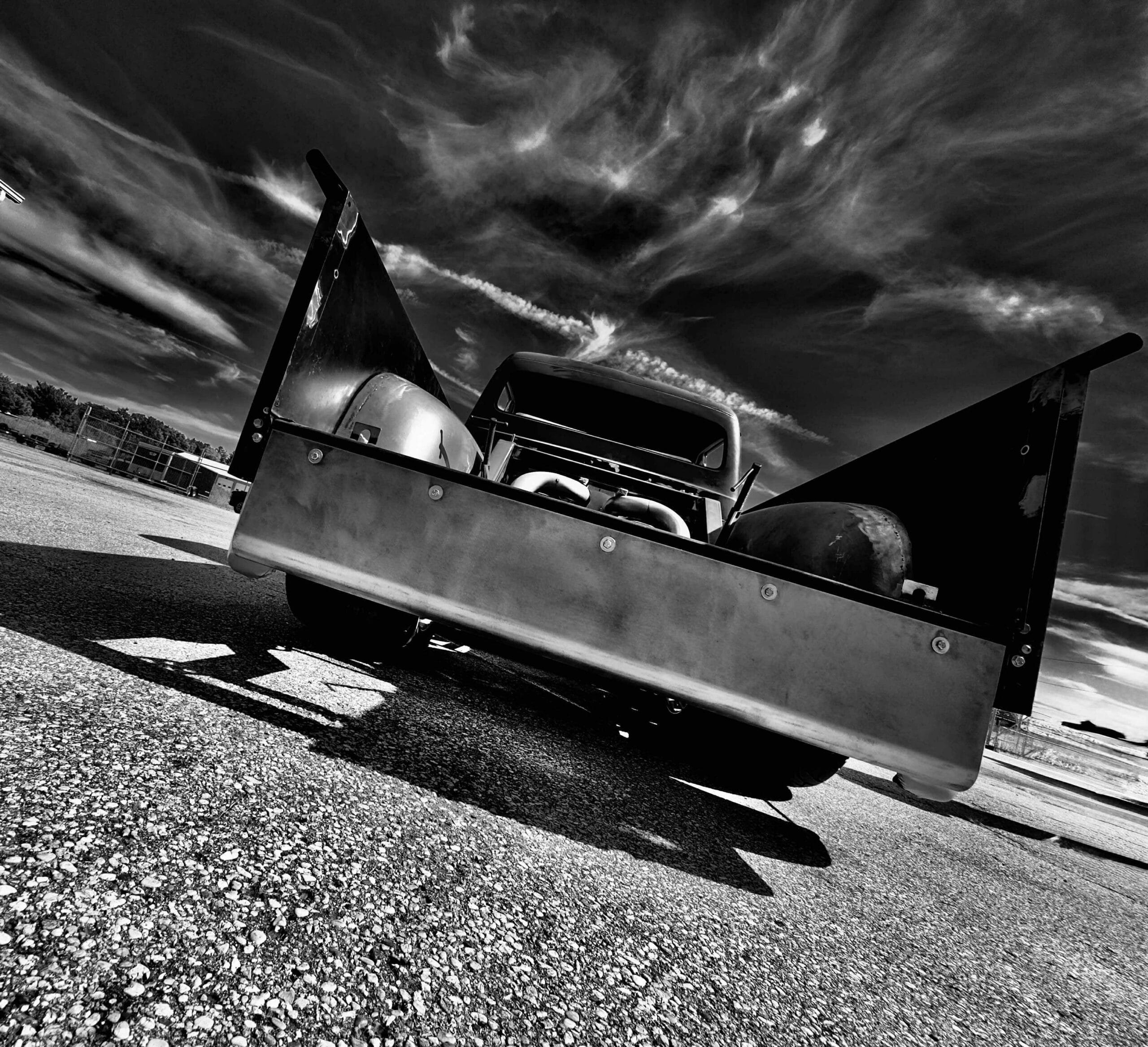 1953 Ford “Wicked 53” tailgate, custom roll pan, wide tires | caption: The view everyone remembers—tailgate down low over big tire.
