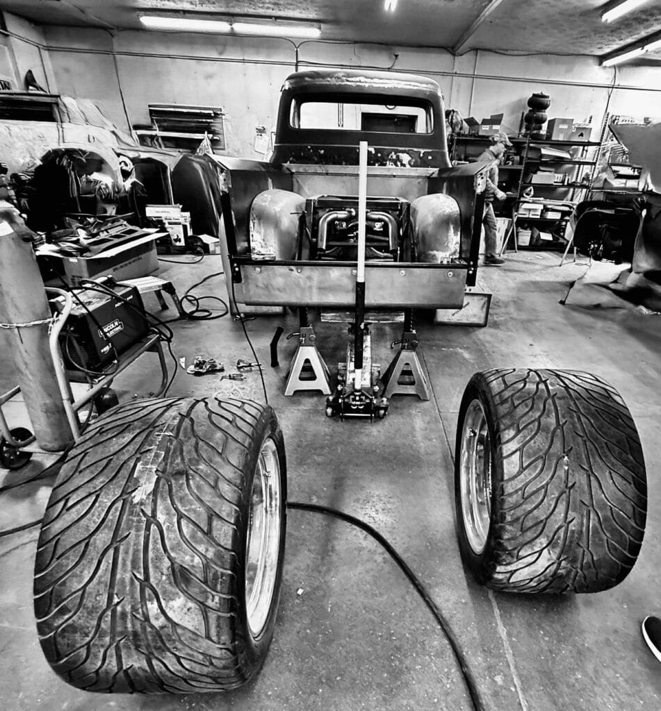 In-progress rear setup on stands with tires removed