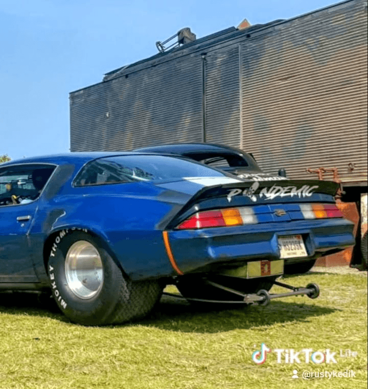 Rear view of Rusty Kedik’s blown 1980 Camaro Z28 “Pandemic” with massive Mickey Thompson slicks, wheelie bars, and signature decklid graphic.