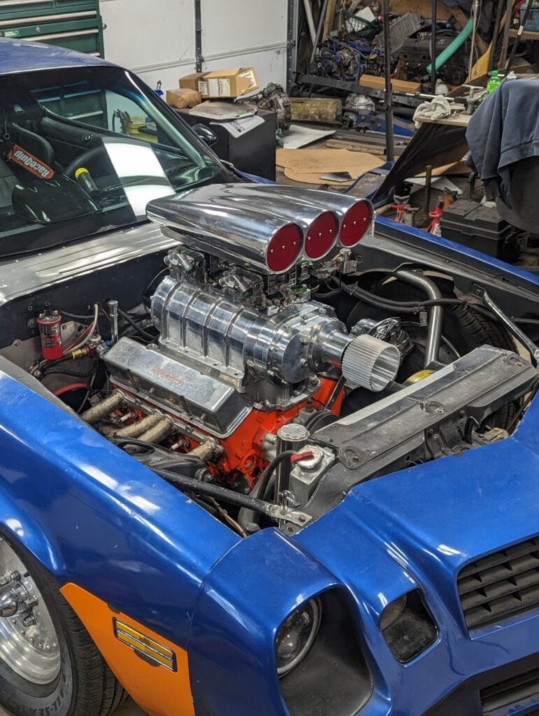 Blown 388 small-block Chevy with an 8-71 supercharger installed in the Pandemic 1980 Camaro Z28 during the mockup stage in the shop.