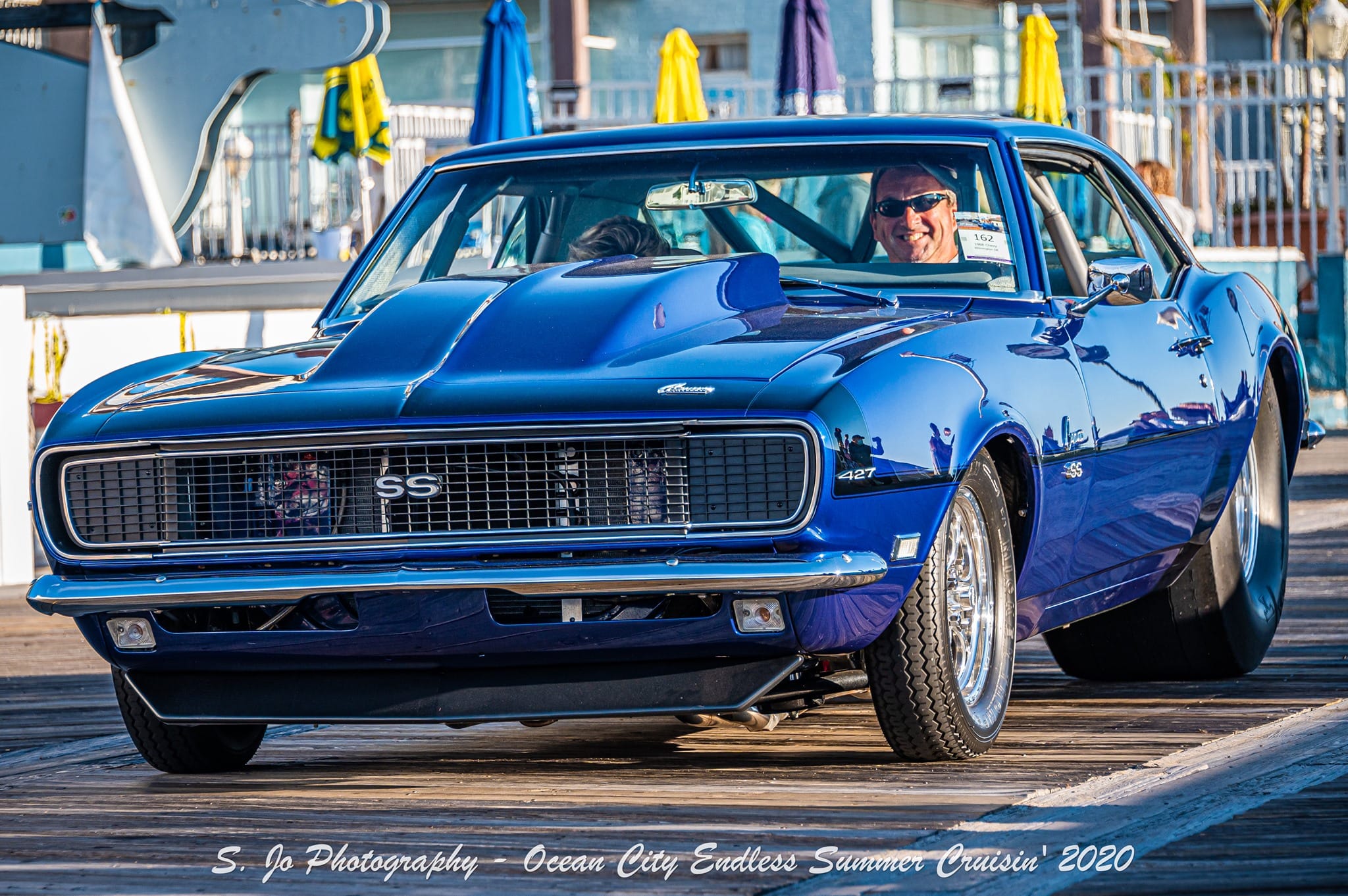Blue 1968 Chevrolet Camaro Pro Street RS/SS cruising the Ocean City boardwalk during a car event