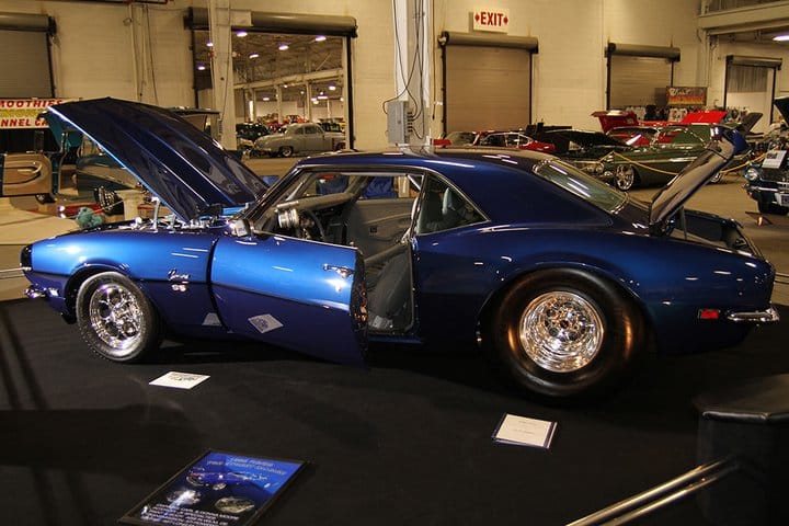 1968 Chevrolet Camaro Pro Street on indoor show floor with hood and trunk open