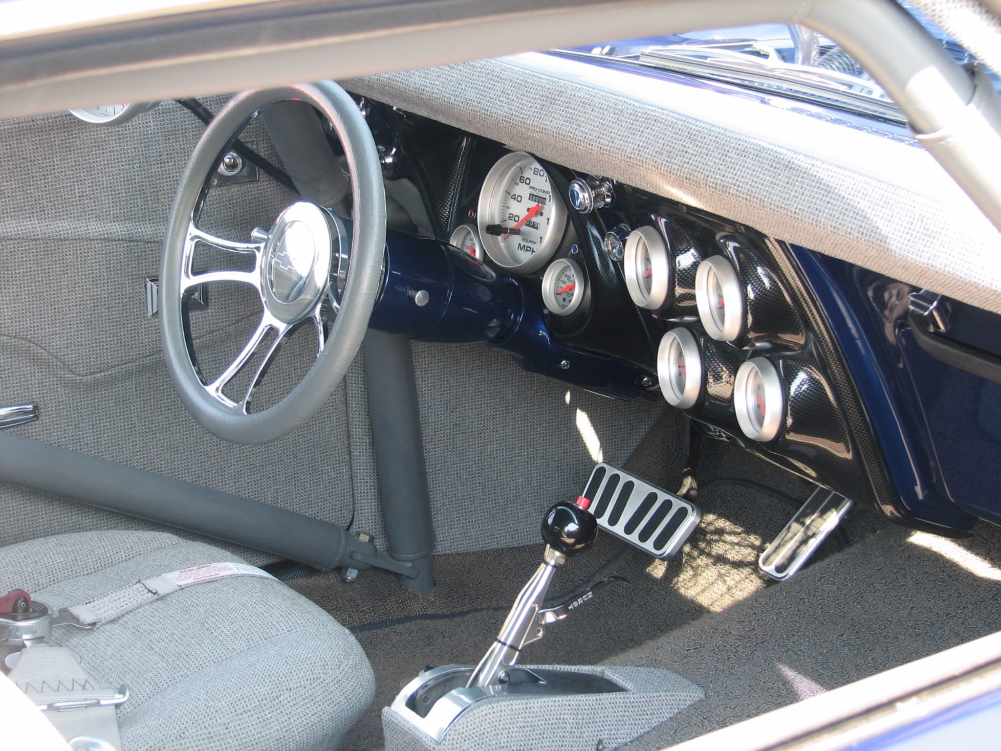 Interior of a Pro Street 1968 Camaro showing Covan classic dash and AutoMeter Phantom gauges