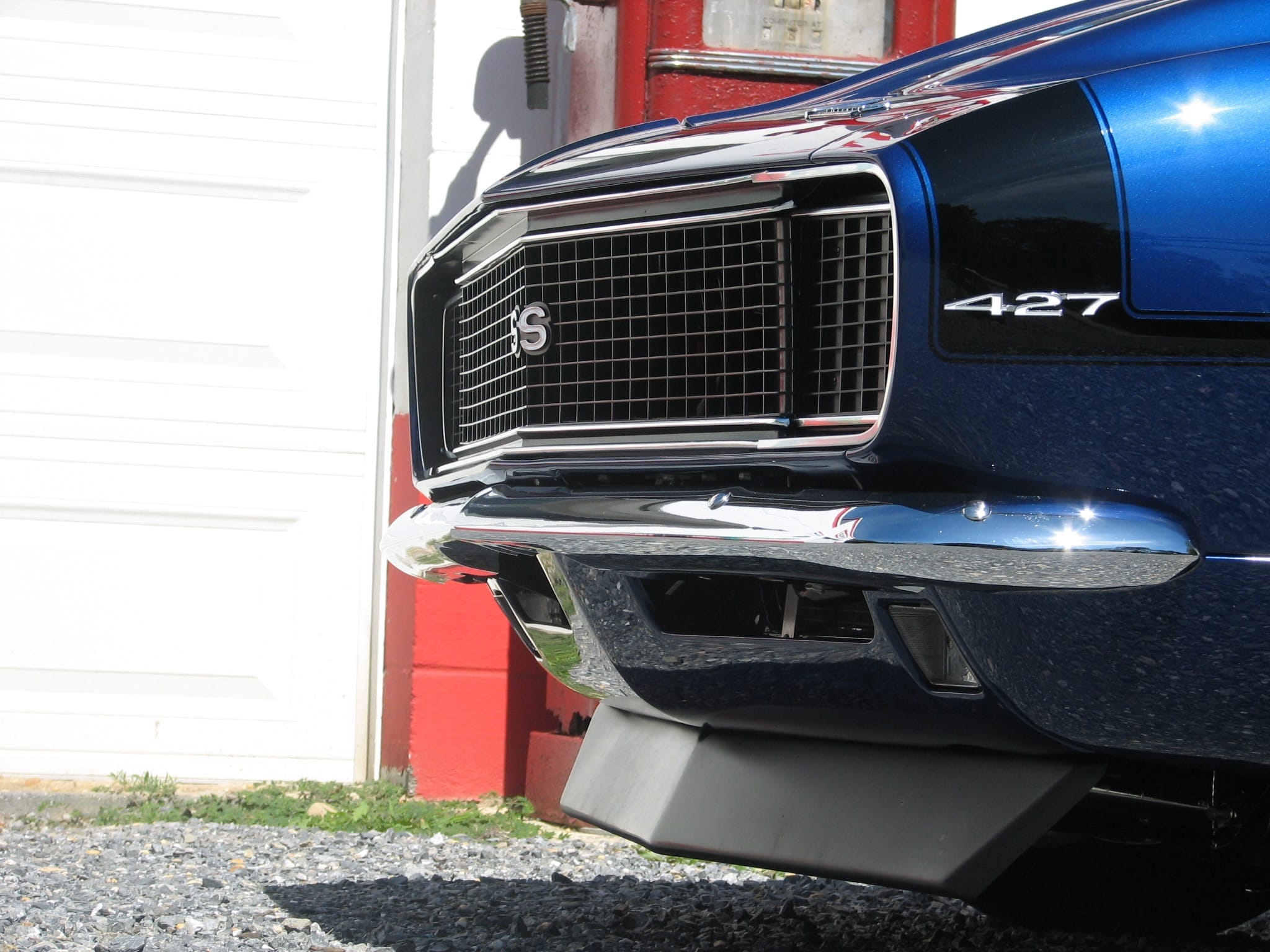 Close up of 1968 Camaro Sapphire front grille SS 427 badge and paint detail